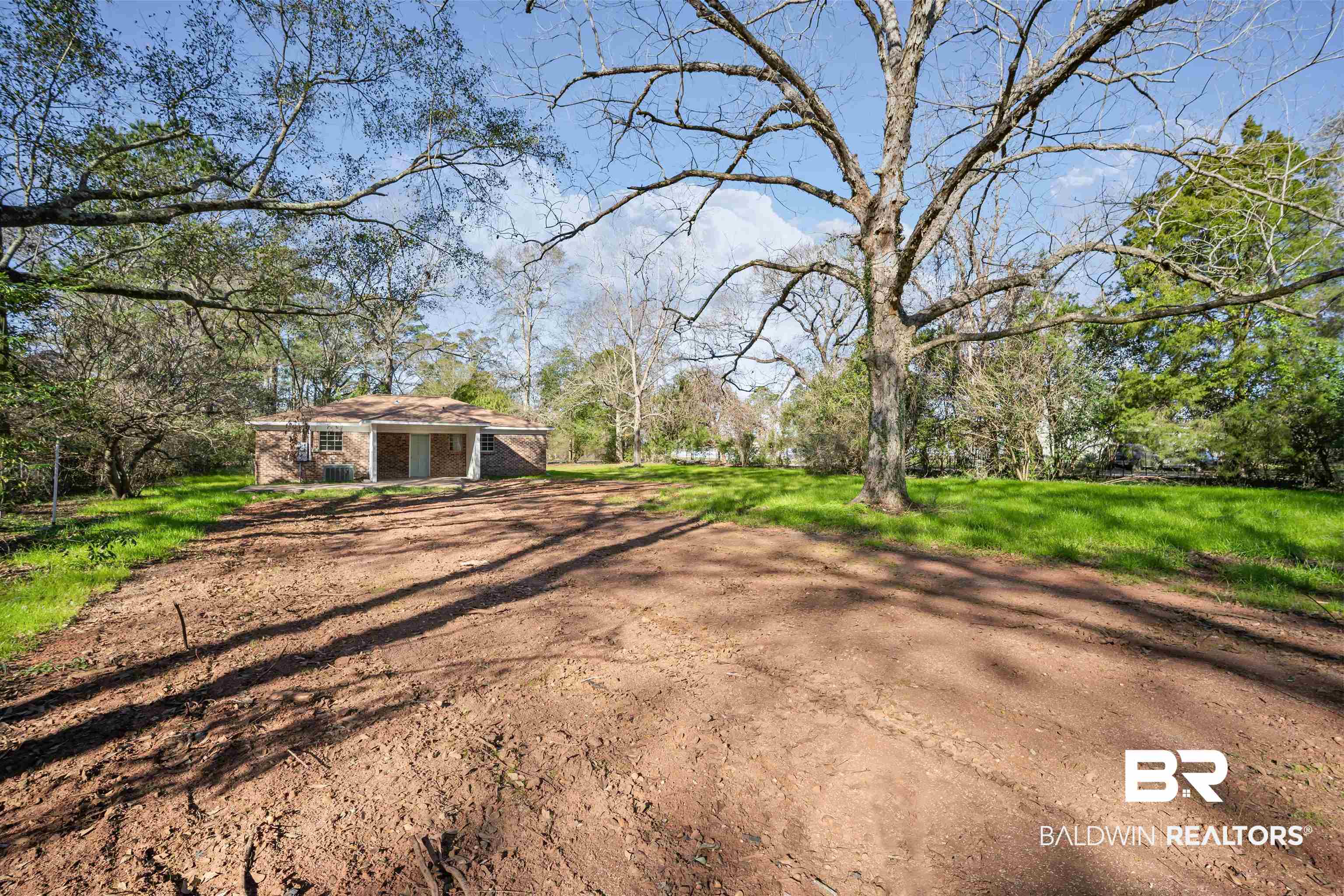 1368 Hubert Pierce Road Mobile, AL 36608 - Photo 24 of 25 View of green lawn with dirt driveway
