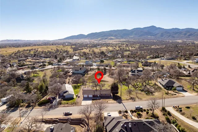 an aerial view of residential house with outdoor space