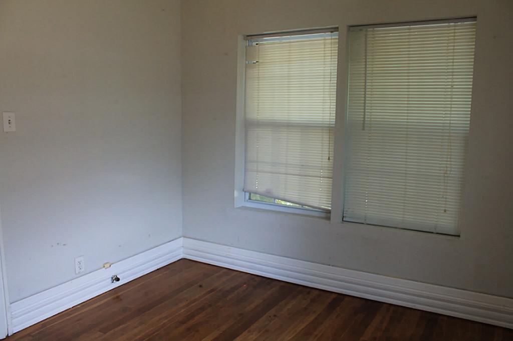 2908 Truxillo Street Houston, TX 77004 - Photo 10 of 12 a view of a small space with wooden floor and a window