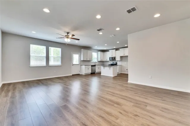 a view of kitchen with cabinets and wooden floor