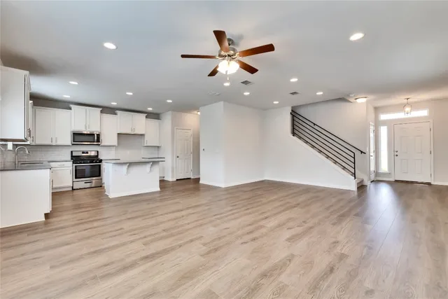a view of kitchen with cabinets and wooden floor