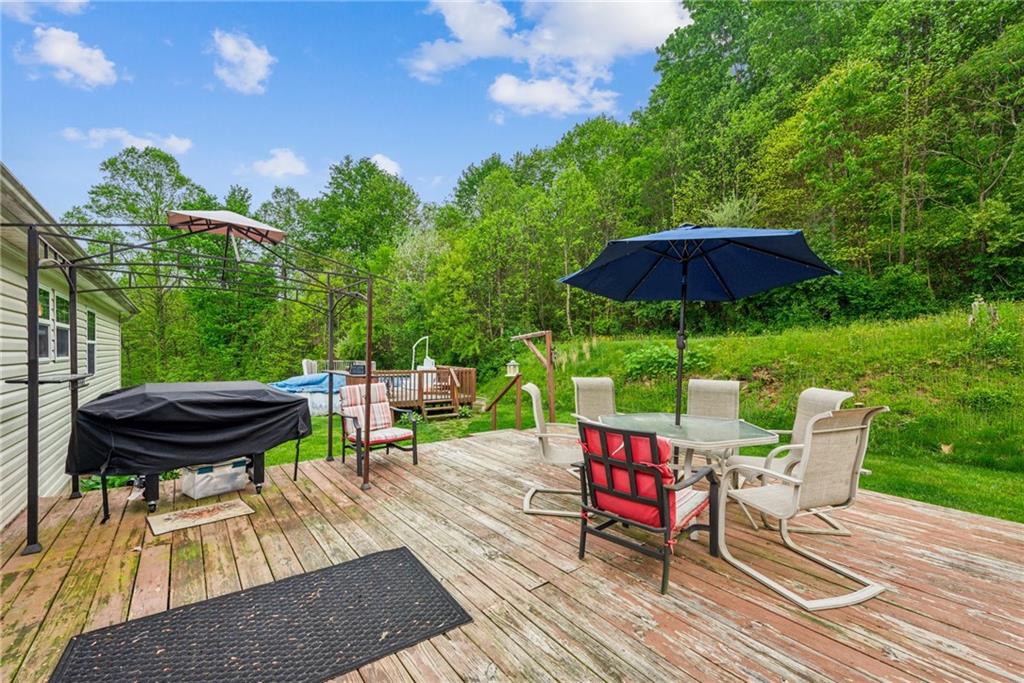 1433 Blacks Hollow Road Spring Church, PA 15686 - Photo 30 of 37 Conveniently ;located off the Dining Room Sliding glass door, this great deck is perfect for your coffee or tea, entertaining, & dining!