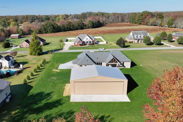 an aerial view of a house with a garden