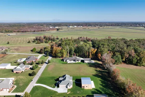 an aerial view of a house with a garden