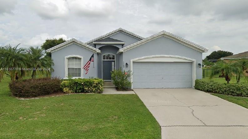3665 Barred Owl Road Lakeland, FL 33811 - Photo 1 of 7 a front view of a house with a yard
