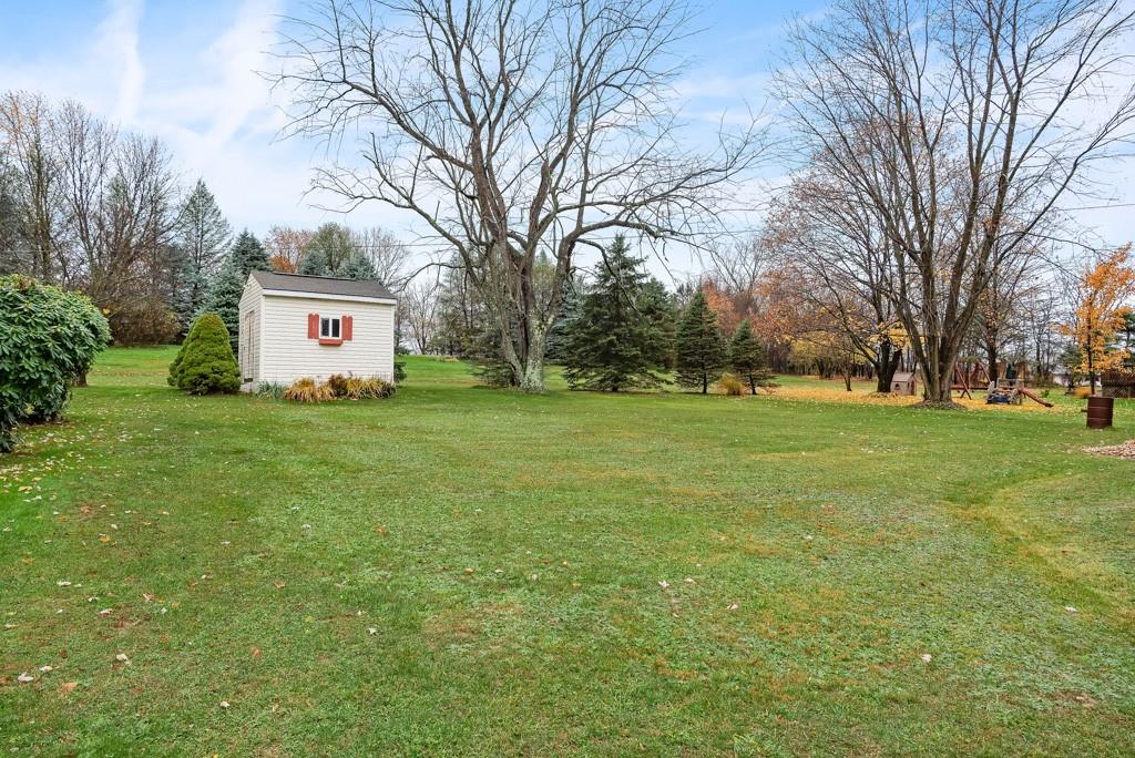 60 Fezell Road Freedom, PA 15042 - Photo 19 of 21 a sign board in front of a big yard with large trees