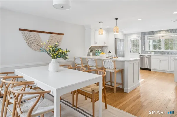 a view of kitchen with cabinets and wooden floor