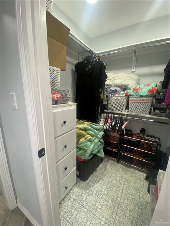 814 North Flag Street Pharr, TX 78577 - Photo 14 of 16 a view of walk in closet with clothes and shoes