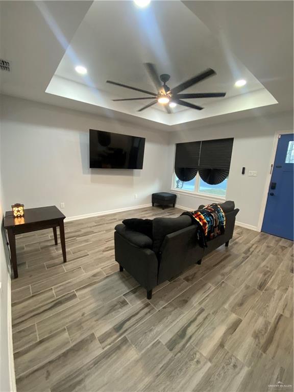 814 North Flag Street Pharr, TX 78577 - Photo 3 of 16 a living room with furniture and a flat screen tv