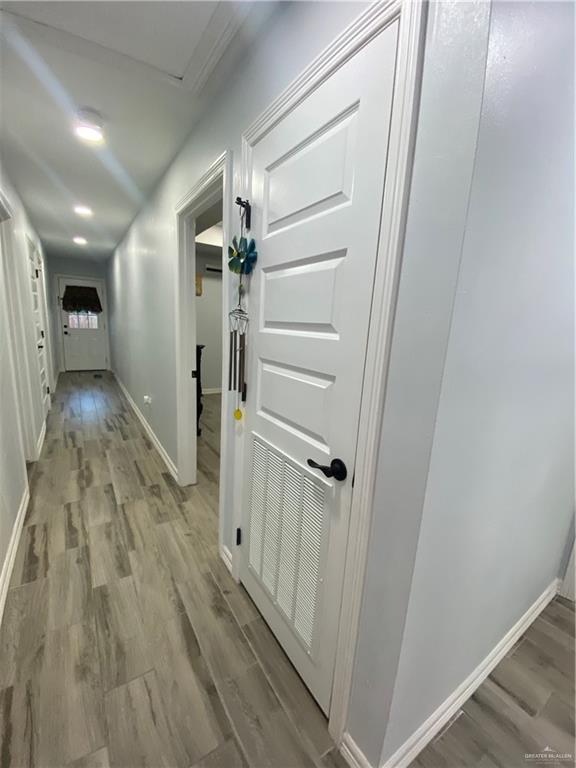 814 North Flag Street Pharr, TX 78577 - Photo 4 of 16 a view of a hallway with wooden floor