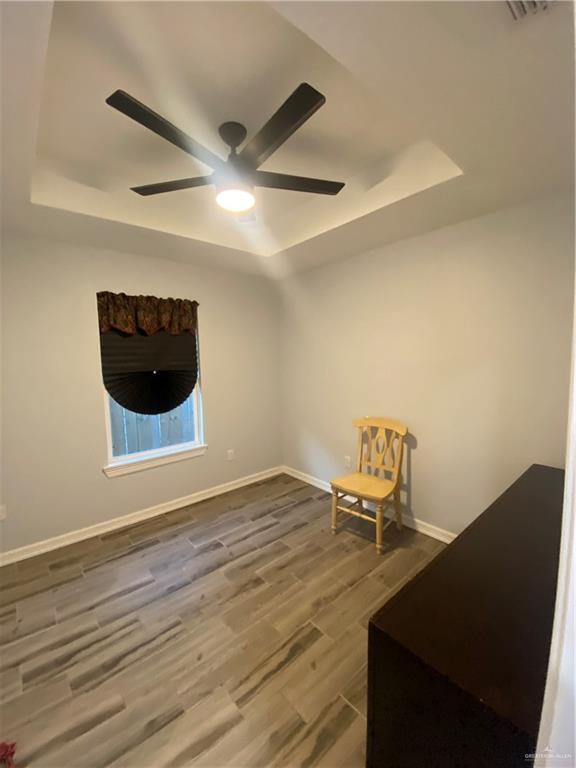 814 North Flag Street Pharr, TX 78577 - Photo 9 of 16 a view of a livingroom with chairs and wooden floor