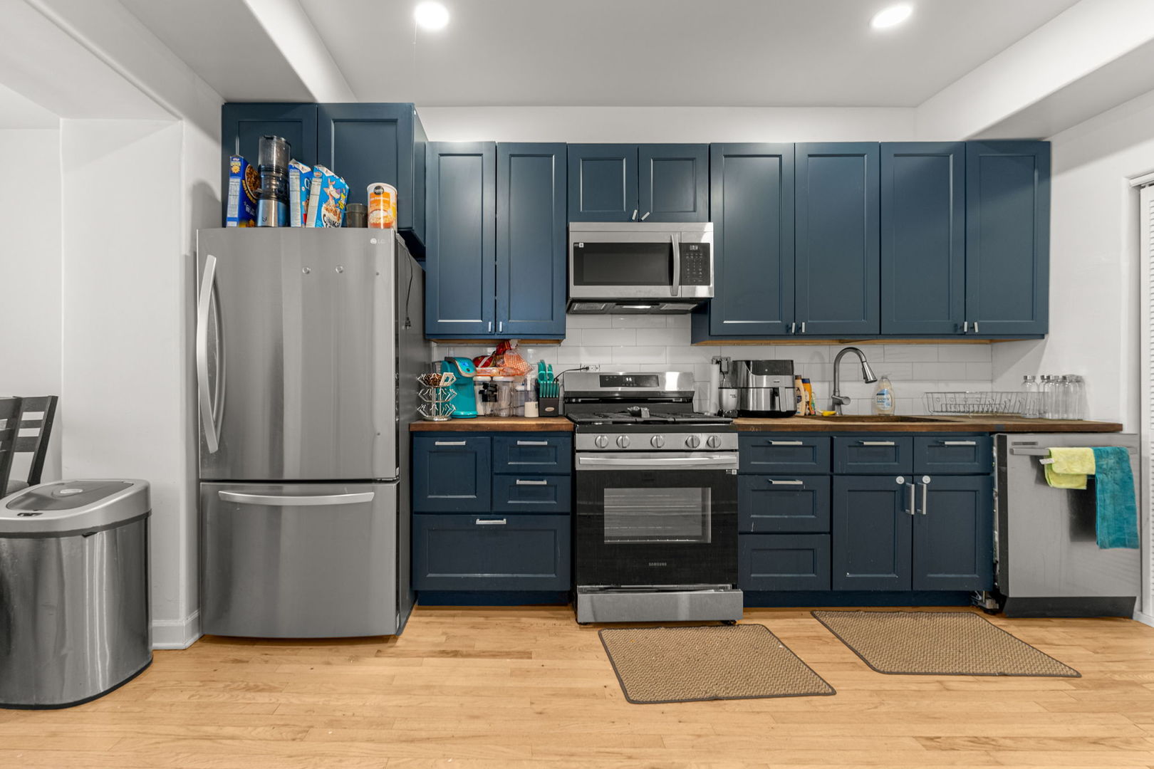 6722 South Ridgeland Avenue, Unit 3S Chicago, IL 60649 - Photo 13 of 17 a kitchen with stainless steel appliances granite countertop a refrigerator stove and microwave