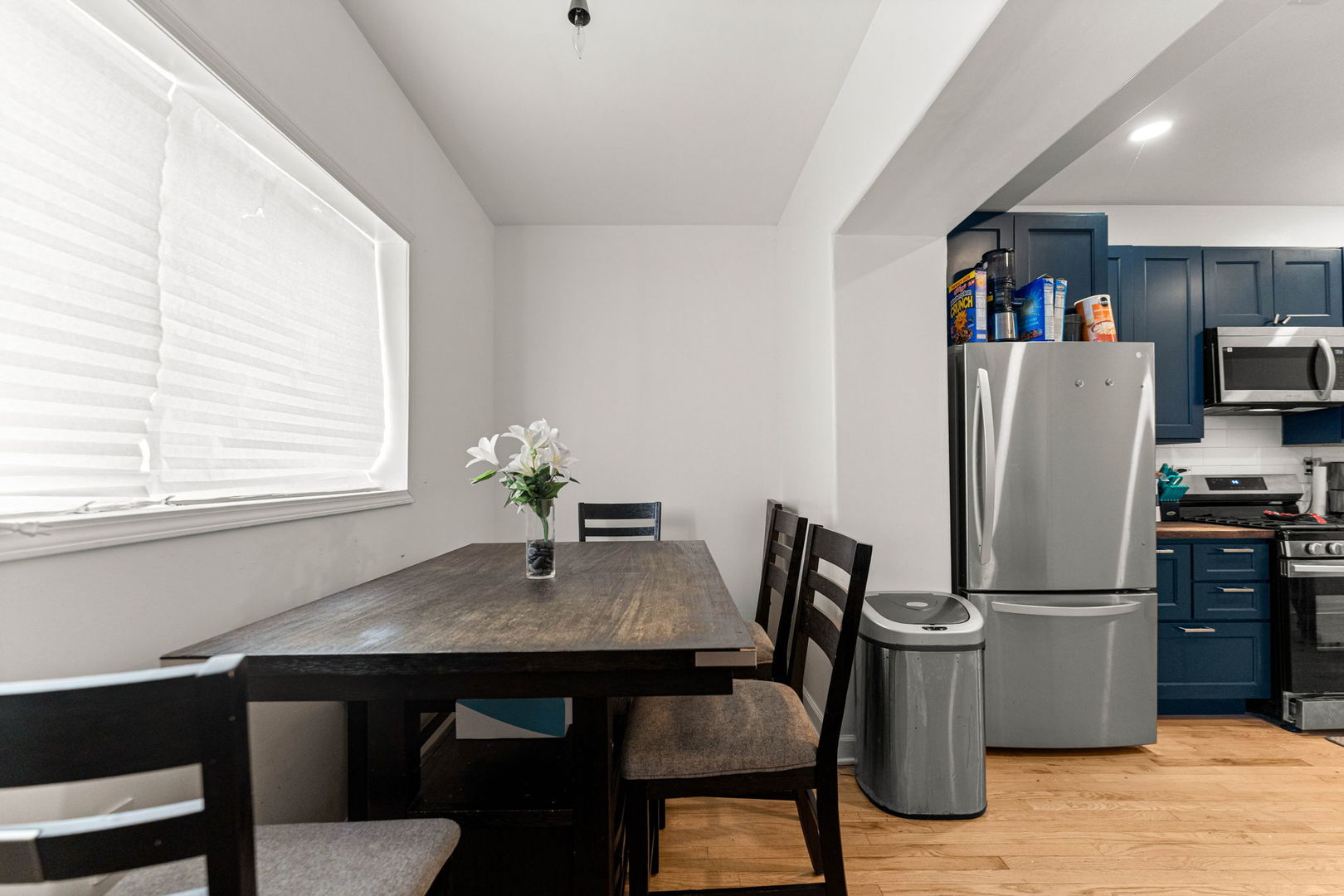 6722 South Ridgeland Avenue, Unit 3S Chicago, IL 60649 - Photo 14 of 17 a kitchen with a table and refrigerator