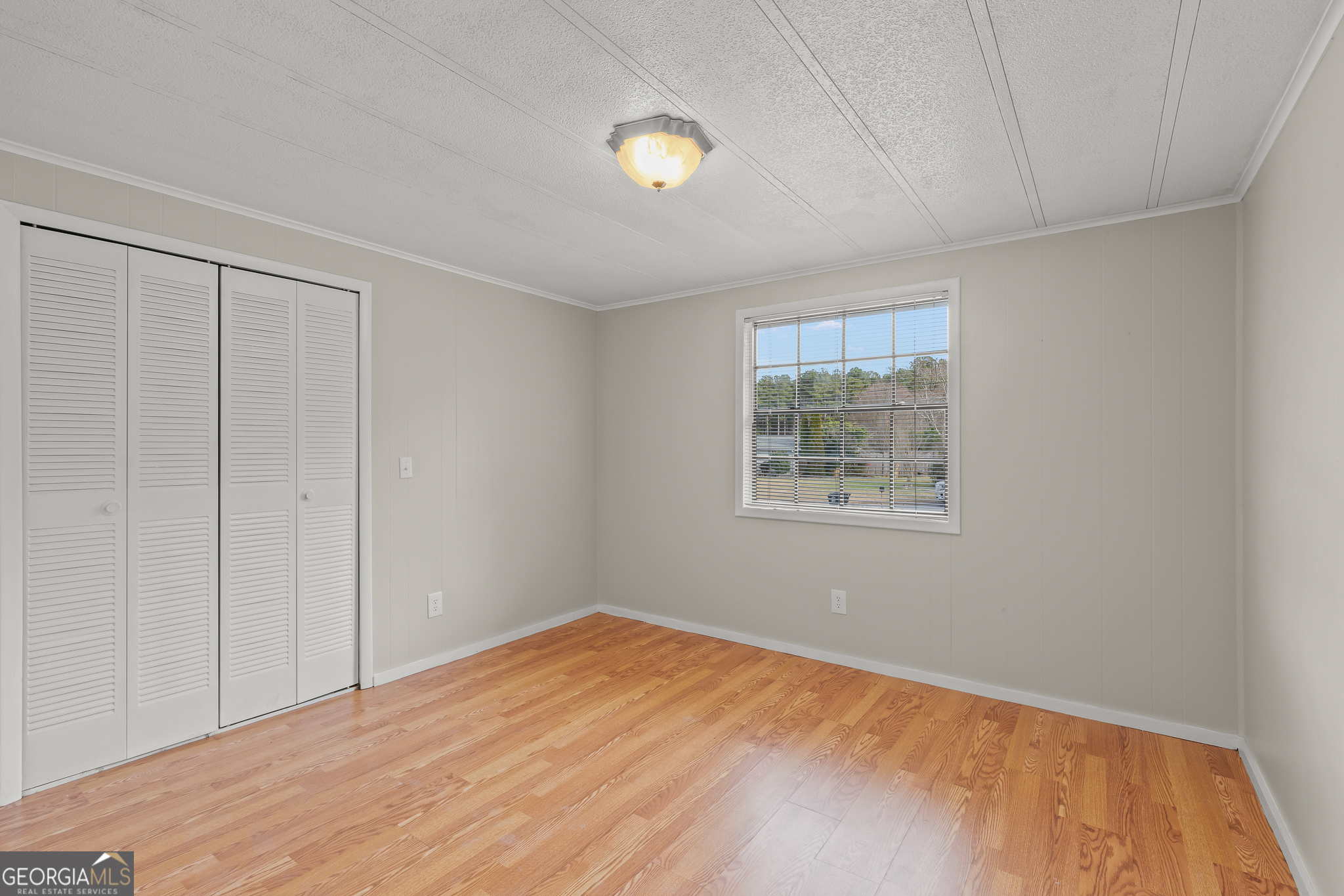 115 Valley View Court Tyrone, GA 30290 - Photo 9 of 15 a view of an empty room with window and closet area