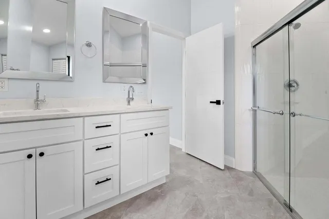 a bathroom with a sink and mirror