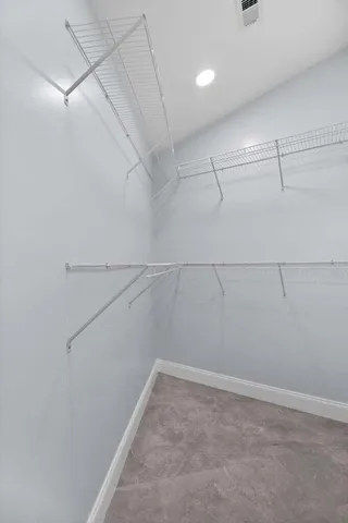 a view of a room with racks on the wall