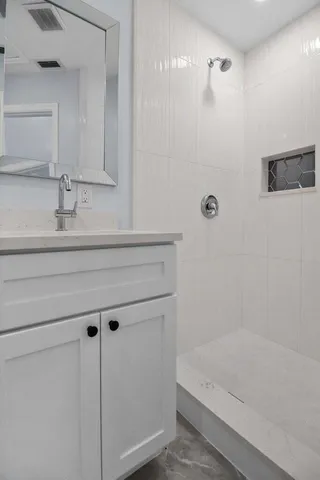 a bathroom with a bathtub and a sink
