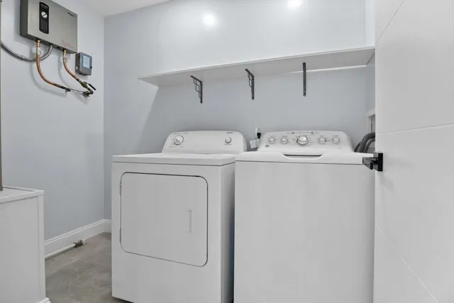a utility room with dryer and washer