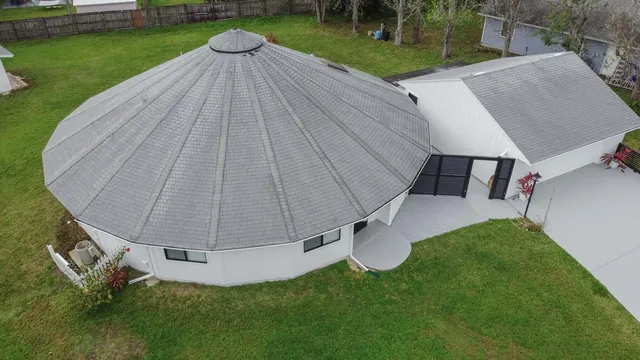a view of a backyard with sitting area