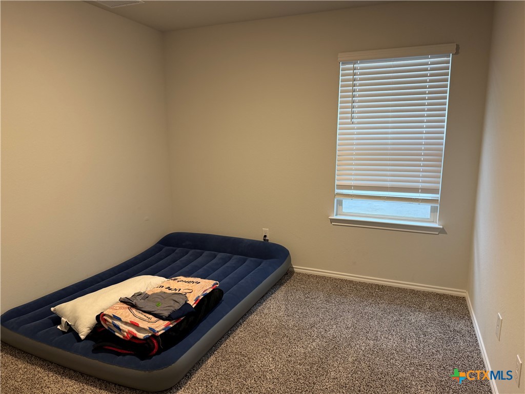 1335 Brookfield Street Temple, TX 76504 - Photo 14 of 15 a room with a bed and a window