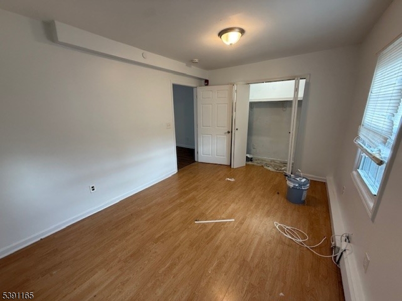 173 Highway 46, Unit L4 Mine Hill, NJ 07803 - Photo 8 of 10 an empty room with windows