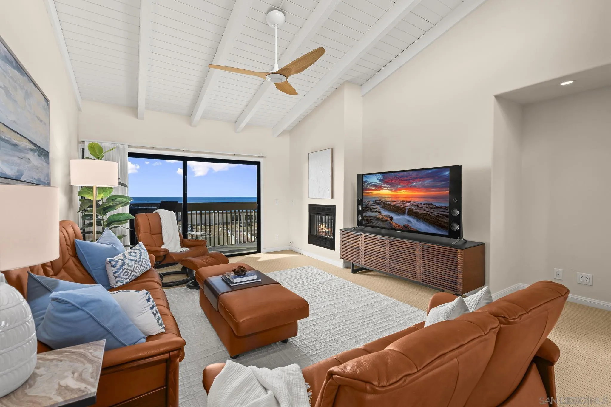 429 South Sierra Avenue, Unit 328 Solana Beach, CA 92075 - Photo 11 of 43 a living room with furniture and a flat screen tv