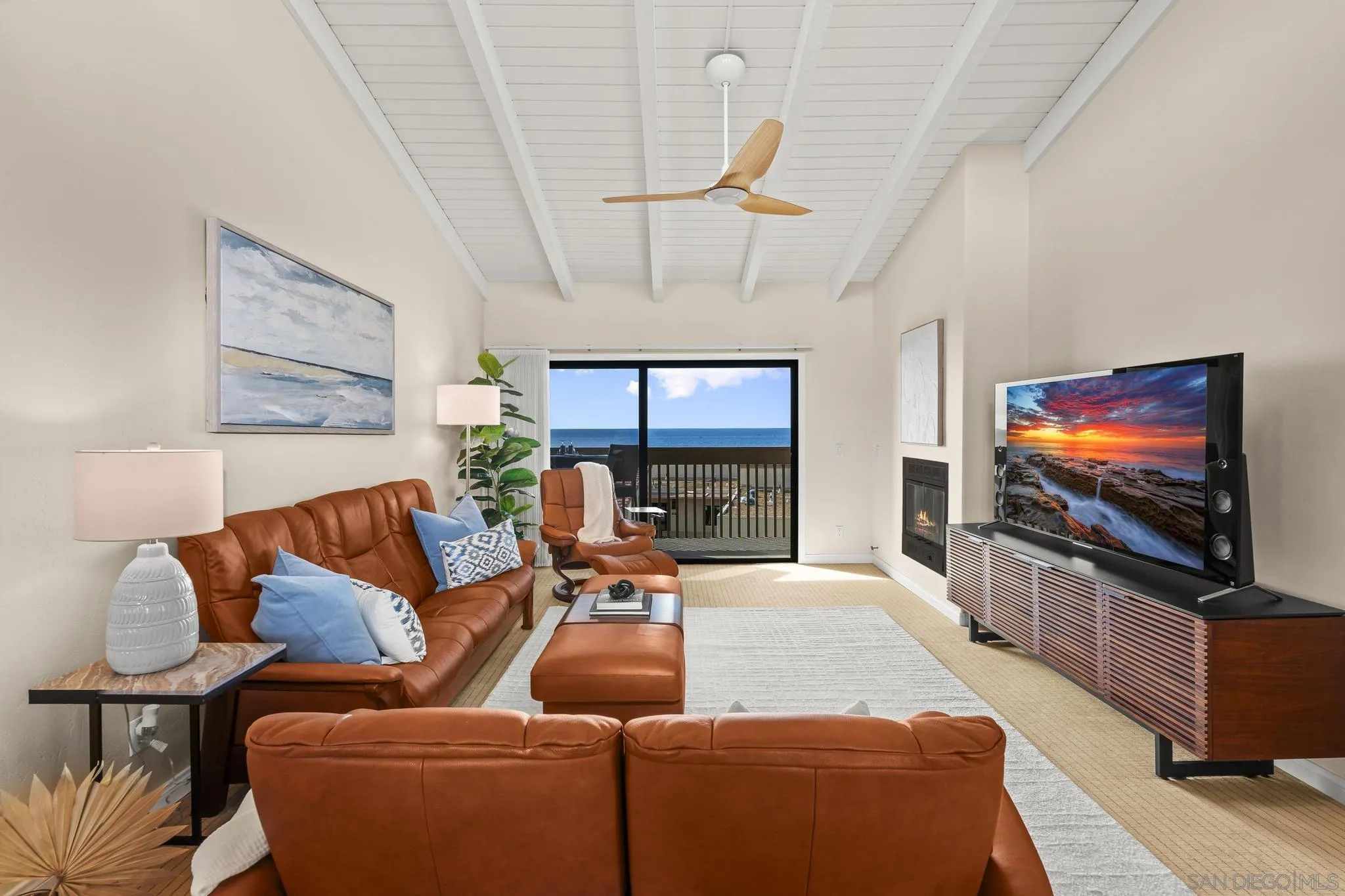 429 South Sierra Avenue, Unit 328 Solana Beach, CA 92075 - Photo 12 of 43 a living room with furniture and a flat screen tv