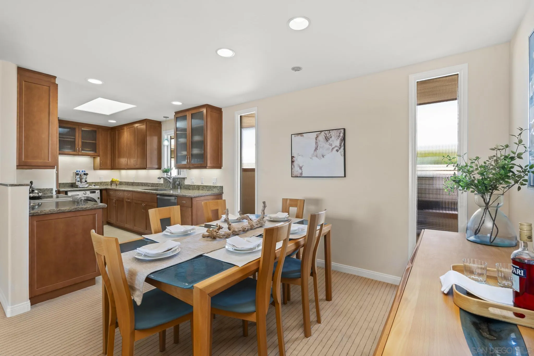 429 South Sierra Avenue, Unit 328 Solana Beach, CA 92075 - Photo 22 of 43 a view of a dining room with furniture and a potted plant