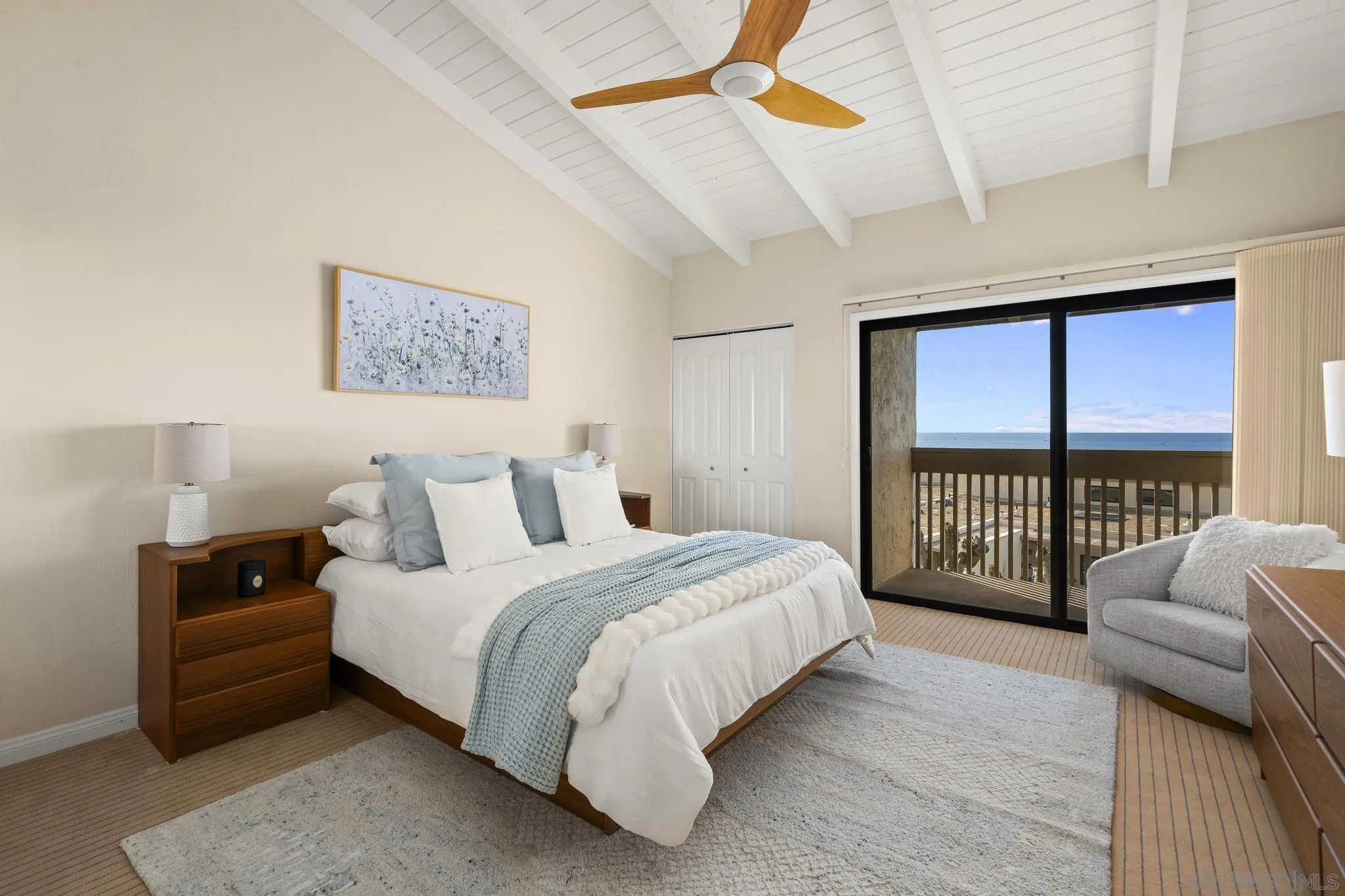 429 South Sierra Avenue, Unit 328 Solana Beach, CA 92075 - Photo 27 of 43 a bedroom with a bed a couch and a window