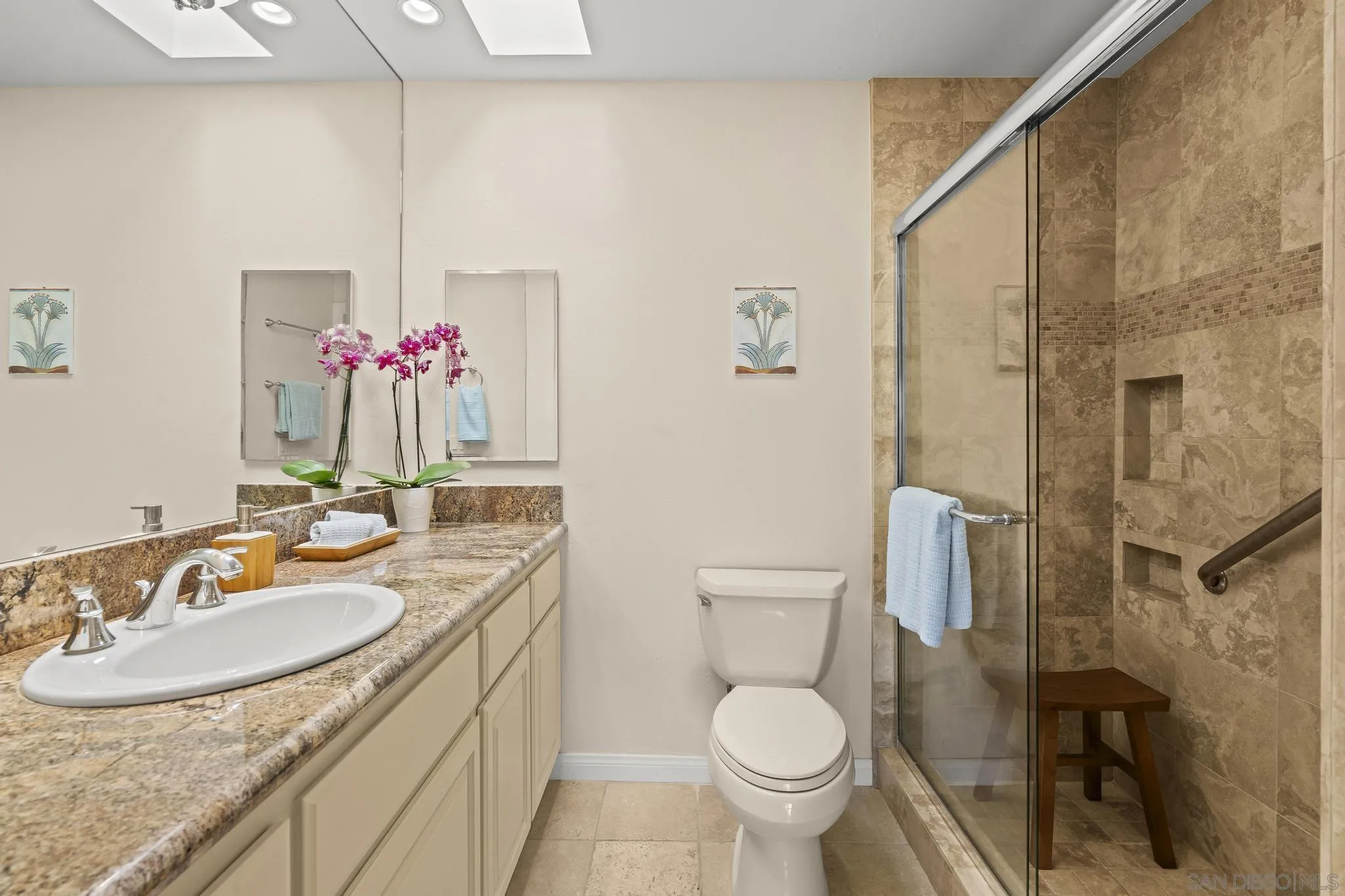 429 South Sierra Avenue, Unit 328 Solana Beach, CA 92075 - Photo 35 of 43 a bathroom with a granite countertop sink toilet and shower