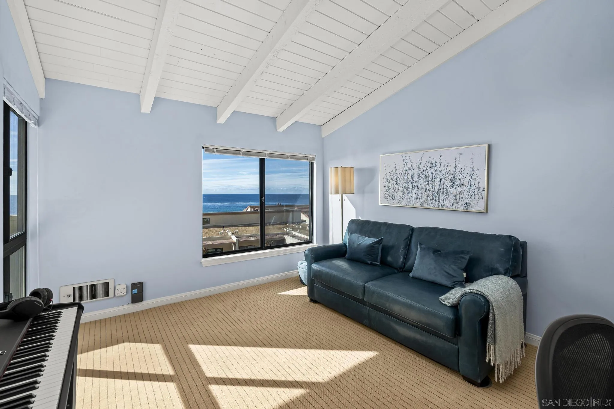 429 South Sierra Avenue, Unit 328 Solana Beach, CA 92075 - Photo 37 of 43 a living room with furniture and a large window