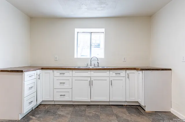 a view of a kitchen with cabinets