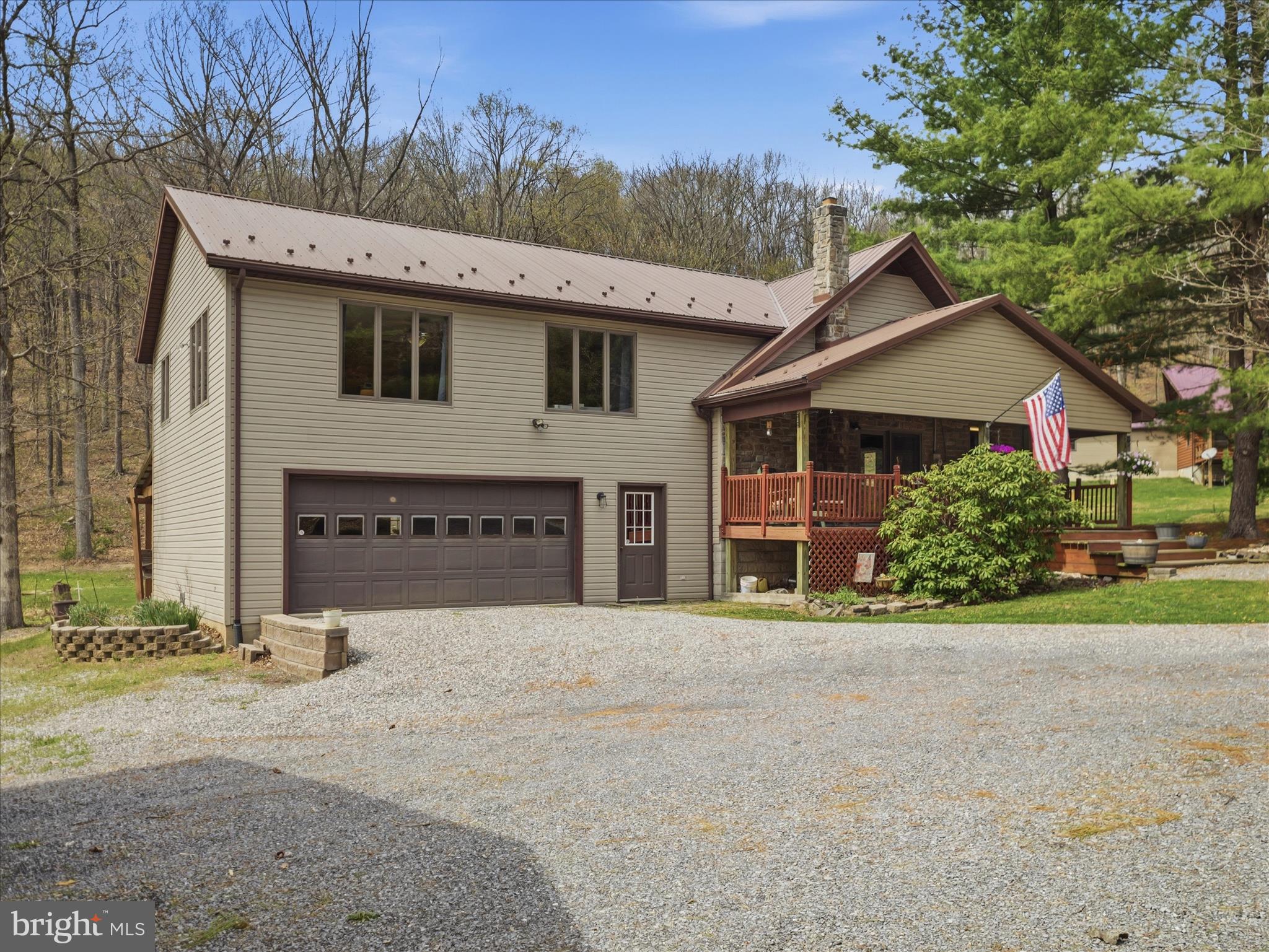 a view of a house with a yard and garage