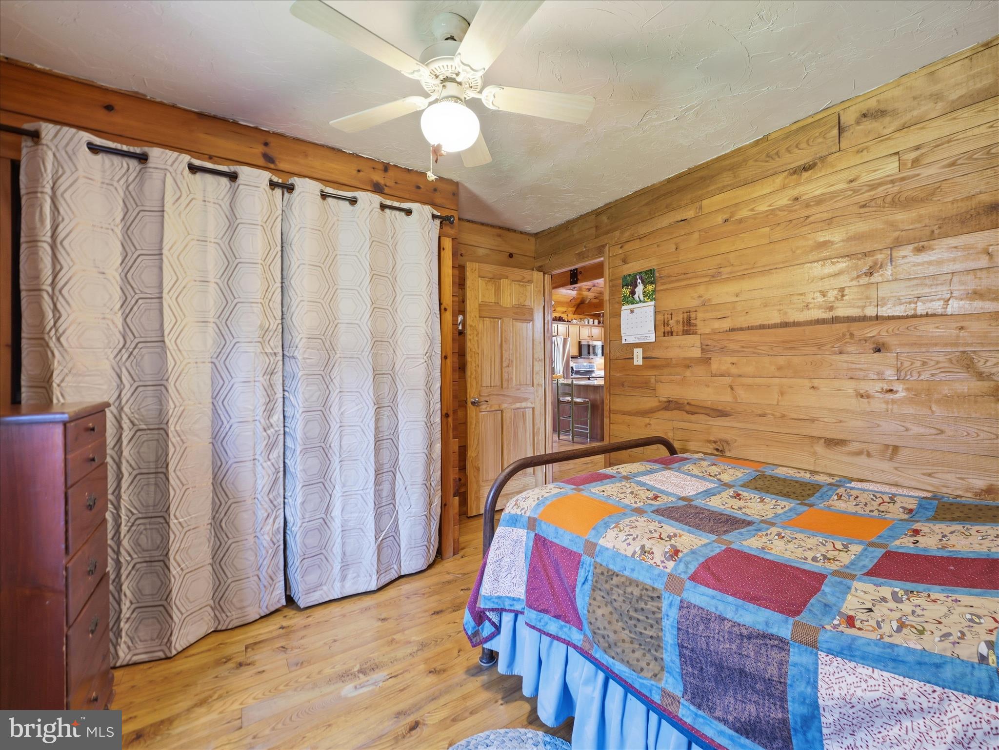 13375 Upper Strasburg Road Upperstrasburg, PA 17265 - Photo 19 of 32 a bedroom with a bed and a chandelier
