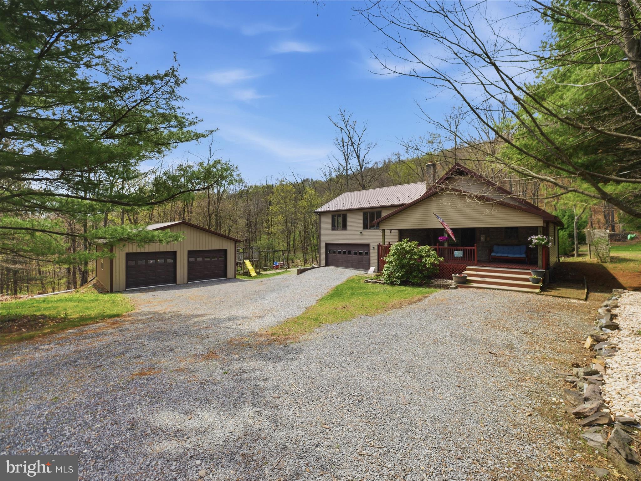 13375 Upper Strasburg Road Upperstrasburg, PA 17265 - Photo 2 of 32 a front view of a house with a yard and garage