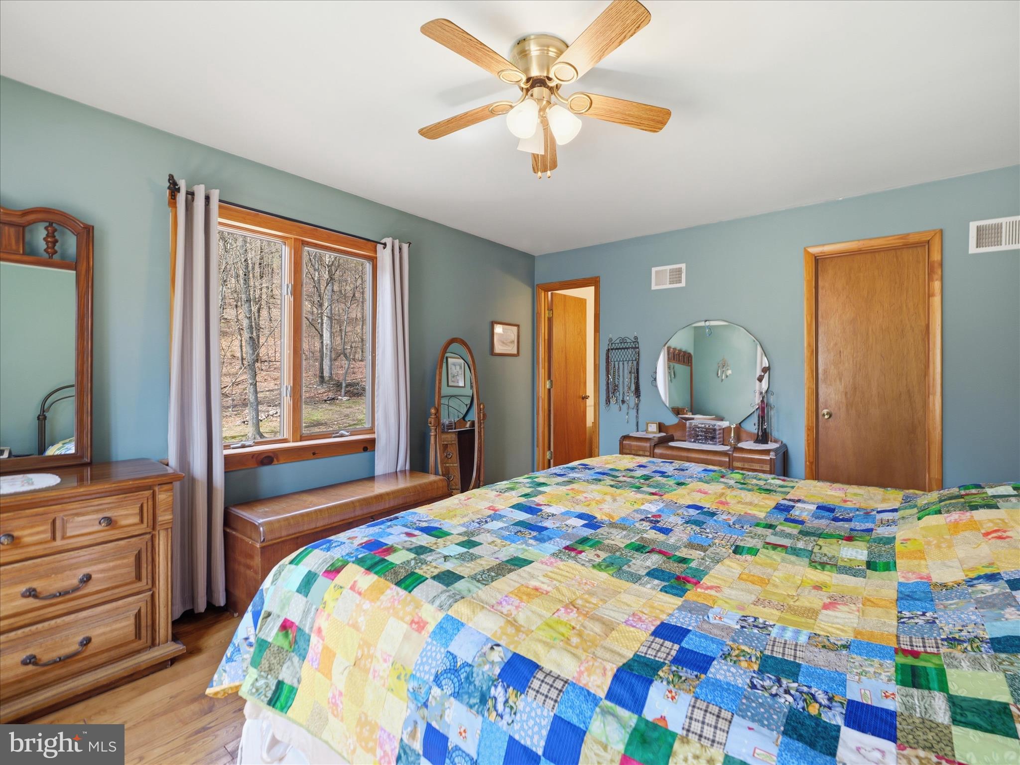 13375 Upper Strasburg Road Upperstrasburg, PA 17265 - Photo 24 of 32 a bedroom with a bed and a dresser in it