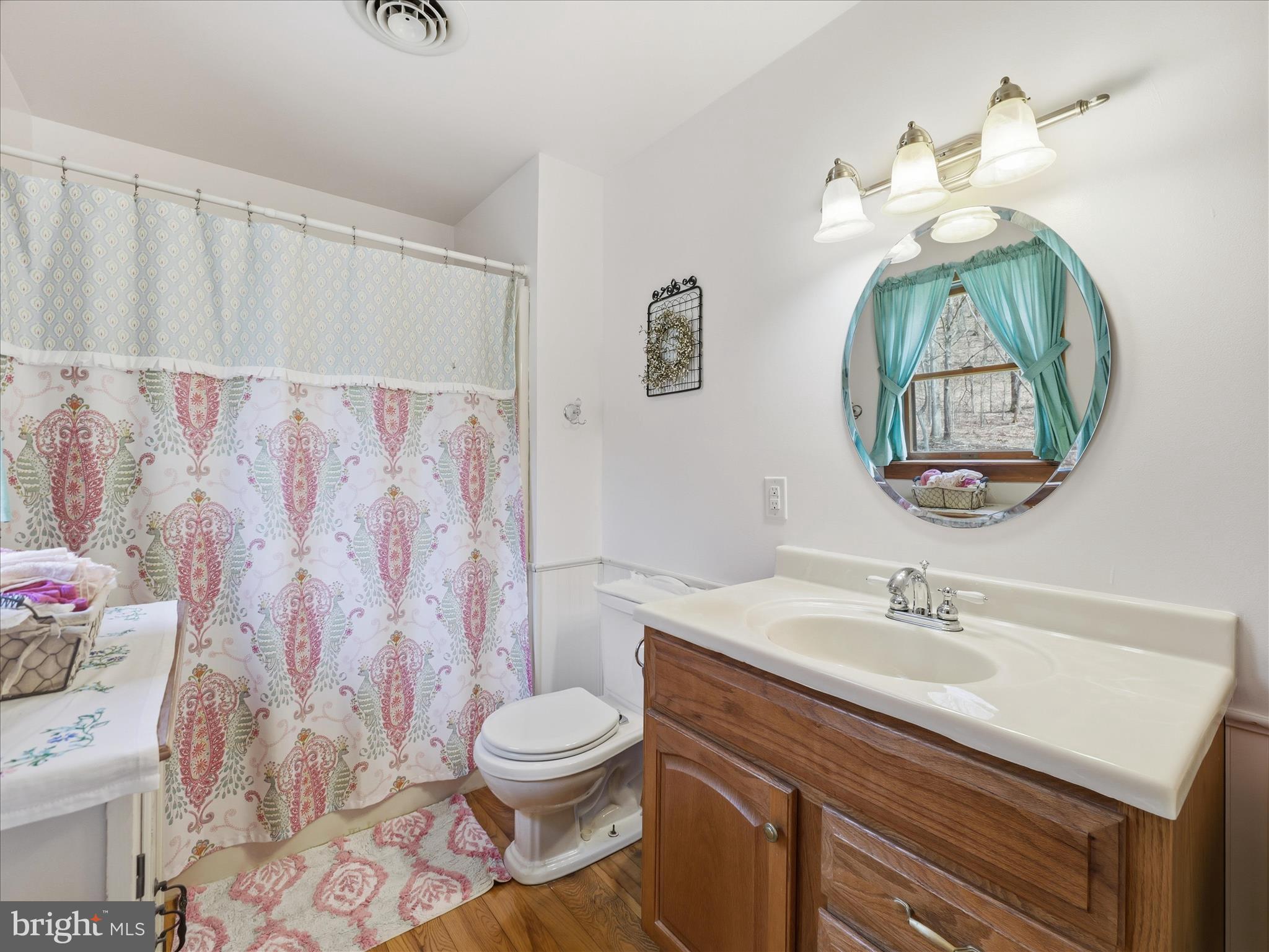 13375 Upper Strasburg Road Upperstrasburg, PA 17265 - Photo 25 of 32 a bathroom with a sink vanity mirror and toilet