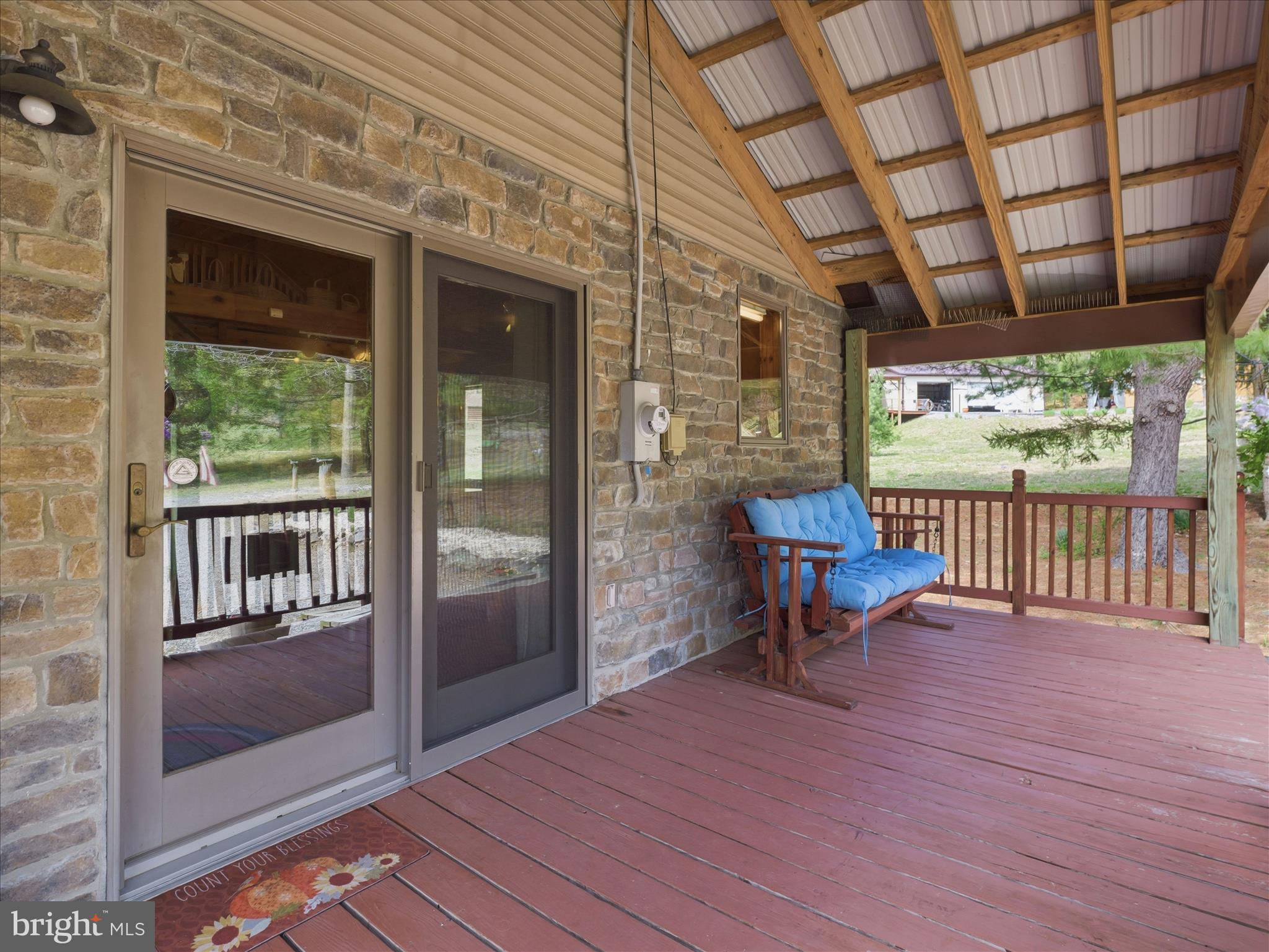 13375 Upper Strasburg Road Upperstrasburg, PA 17265 - Photo 26 of 32 a view of a porch with wooden floor and iron stairs
