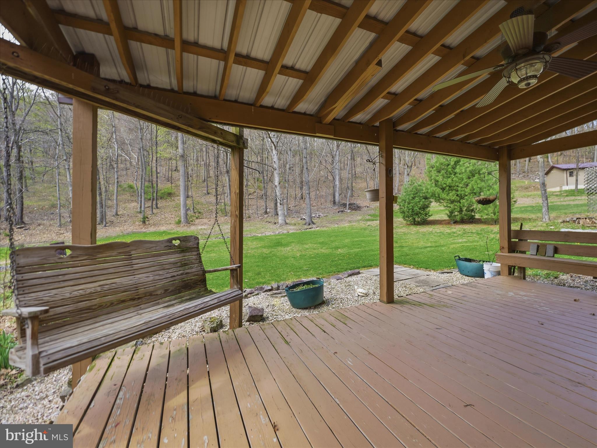 13375 Upper Strasburg Road Upperstrasburg, PA 17265 - Photo 27 of 32 a view of a patio with wooden floor next to a yard