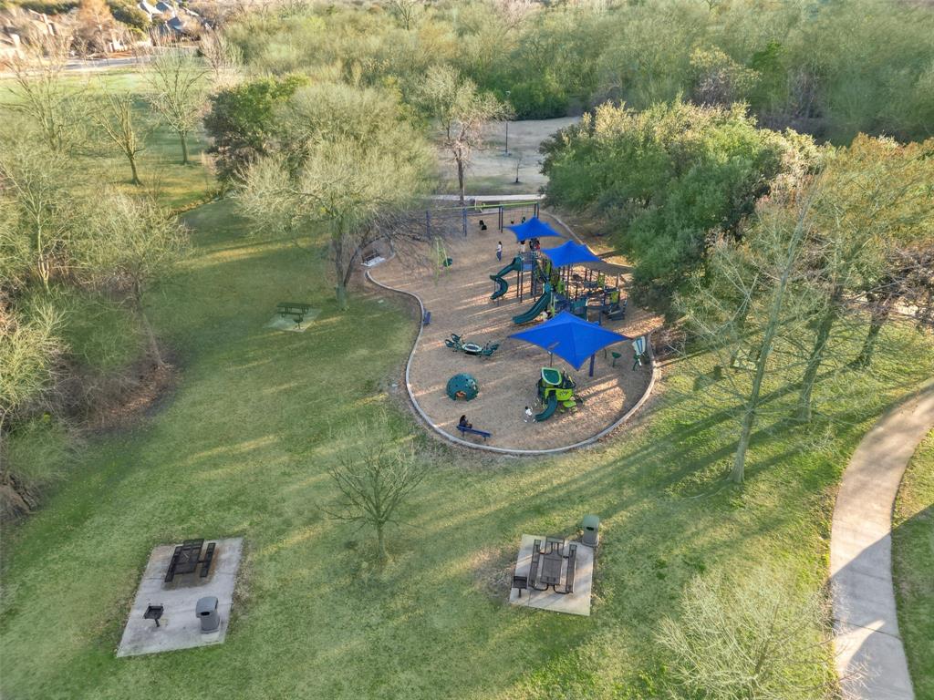 3308 North Spring Drive Richardson, TX 75082 - Photo 35 of 38 Enjoy walking distance access to a beautiful community park featuring trails, playgrounds, a peaceful lake, and covered pavilion.