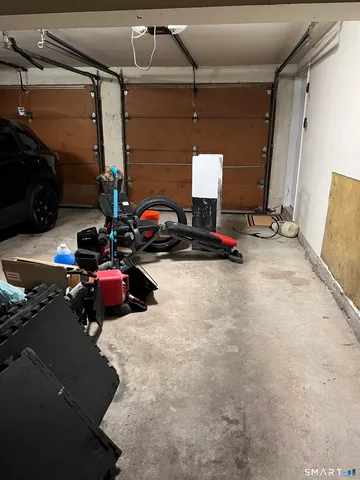 a view of a garage with cars