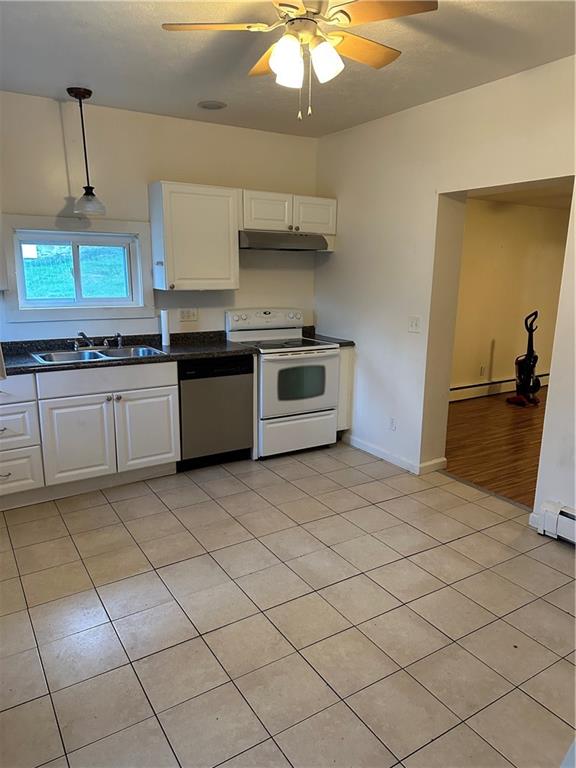 415 Fairview Avenue Butler, PA 16001 - Photo 12 of 17 a kitchen with stainless steel appliances granite countertop a stove a sink and a refrigerator