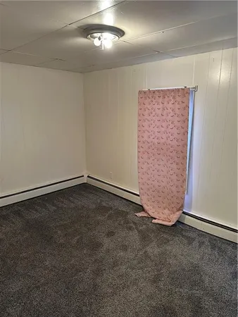 an empty room with a empty space and windows