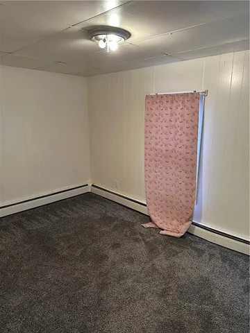 an empty room with a empty space and windows