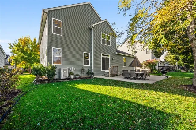 a view of a house with a yard patio and swimming pool