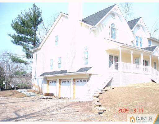 38 Edgewood Road Edison, NJ 08820 - Photo 3 of 5 a view of a white building next to a yard