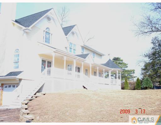 38 Edgewood Road Edison, NJ 08820 - Photo 4 of 5 a view of a white house with large windows