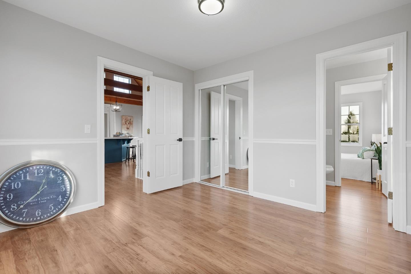 16505 Finley Ridge Road Morgan Hill, CA 95037 - Photo 16 of 44 wooden floor in an empty room and a mirror