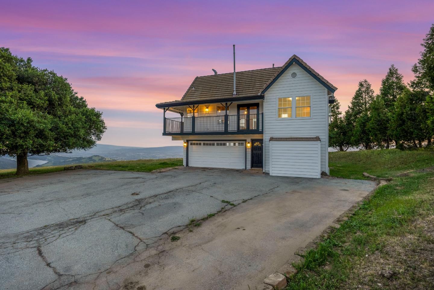 16505 Finley Ridge Road Morgan Hill, CA 95037 - Photo 2 of 44 a front view of a house with a yard and garage