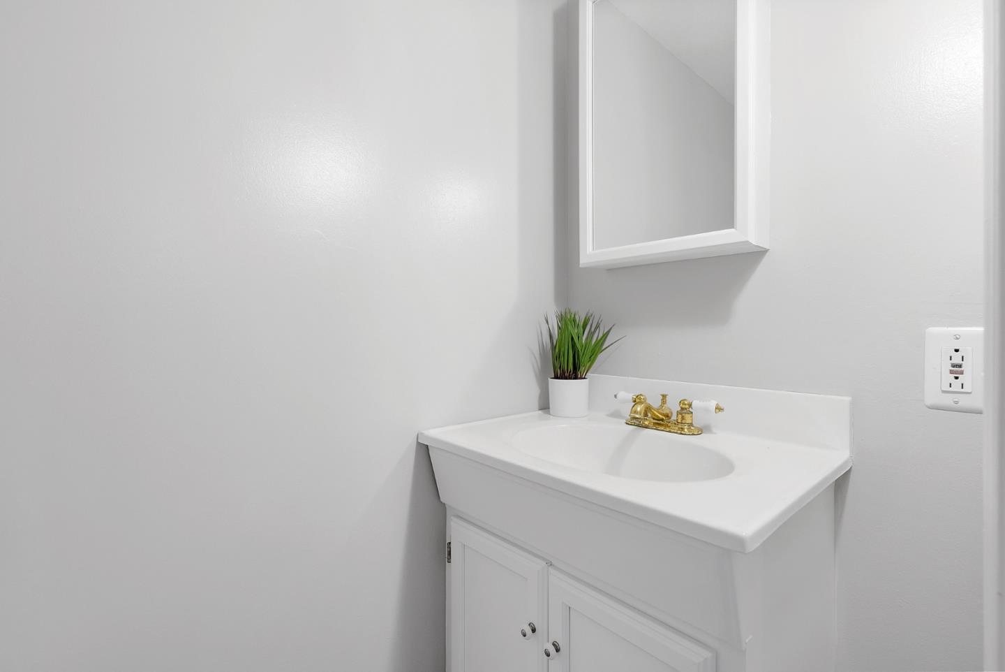 16505 Finley Ridge Road Morgan Hill, CA 95037 - Photo 22 of 44 a bathroom with a sink and cabinets